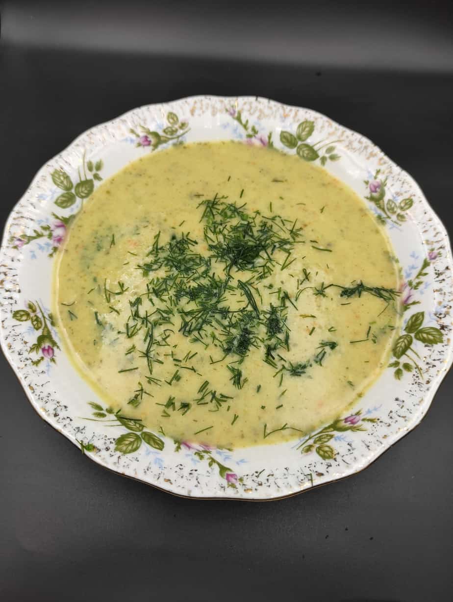 Zupa z ogorkow cucumber soup in a white bowl.