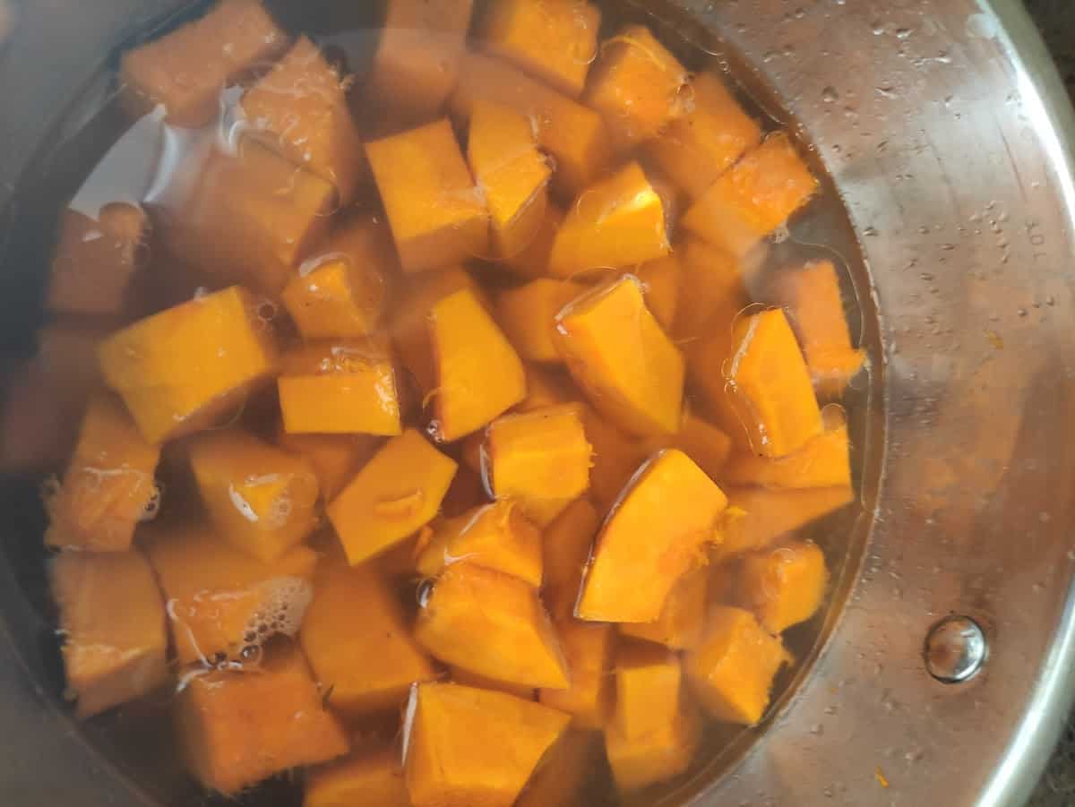 Pumpkin boiling in stock.