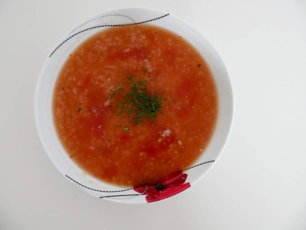 Tomato soup in a white bowl.