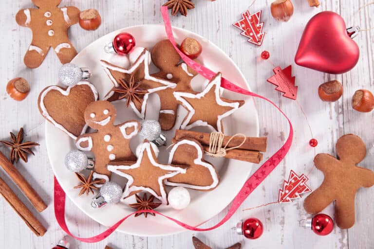 Polish gingerbread cookies on a plate with red and white decorations.