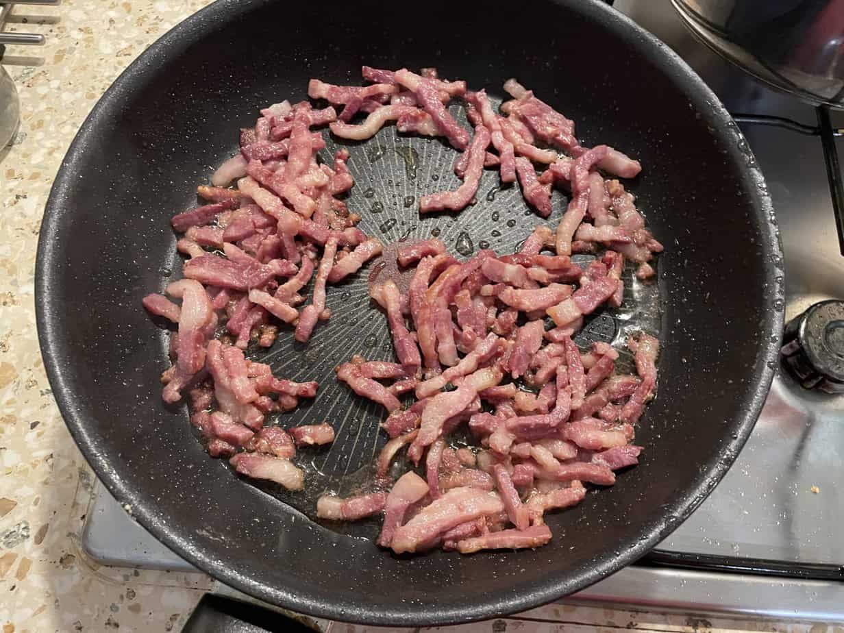 This is a simple recipe for fried bacon, typically cooked in a frying pan on a stove.