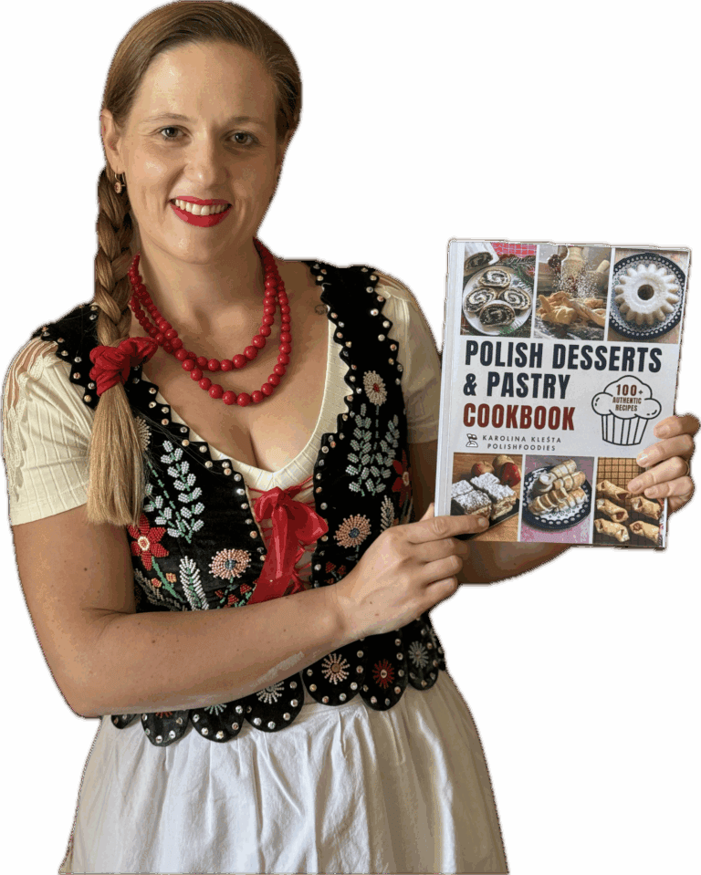 Woman in traditional Polish attire holds a cookbook titled "Polish Desserts & Pastry Cookbook," featuring images of various pastries on the cover—a perfect find for Polish Foodies and fans of authentic Polish food.